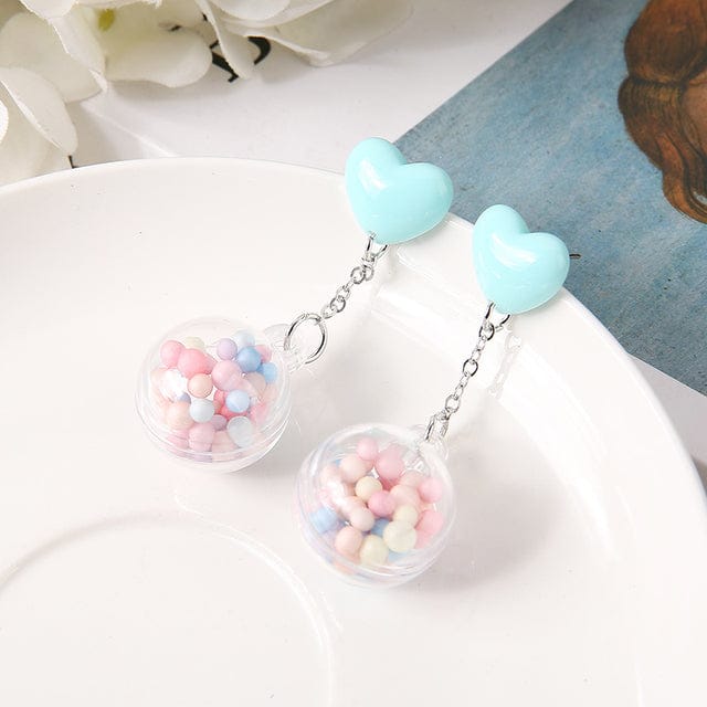 https://thekawaiishoppu.com/cdn/shop/products/1pair-candy-heart-pom-pom-earrings-blue-jewellery-the-kawaii-shoppu-0.jpg?v=1657920837